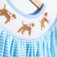 Blue puppy hand smocked girl romper