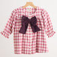 Pink gingham flannel bow dress