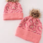 Pink pompom leopard cable beanie