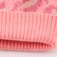 Pink pompom leopard cable beanie