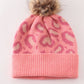 Pink pompom leopard cable beanie