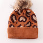 Brown pompom leopard cable beanie