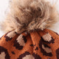 Brown pompom leopard cable beanie