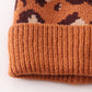 Brown pompom leopard cable beanie